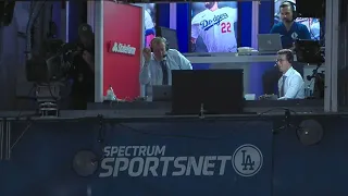 You don't see this every day! Dodgers announcer catches a foul ball, then gives it to a fan!