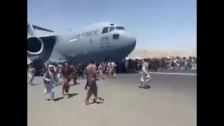 Afghanistan people jumping on top of American military plane as it leaves the Kabul airport