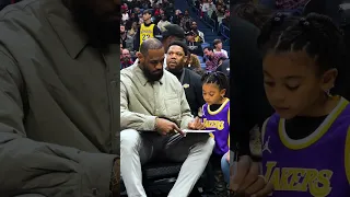 LeBron James signs his book for a young Laker fan #shorts