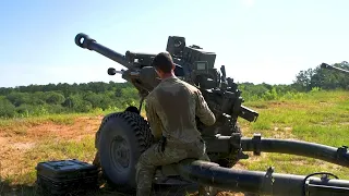 48th Infantry Combat Team fire an M119 105 mm howitzer