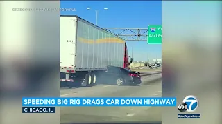 Video: Big rig drags car down highway with driver pinned underneath trailer l ABC7