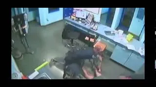 Fla  woman chokes officer at station after arrest