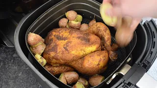 Air fryer whole chicken with potatoes and asparagus