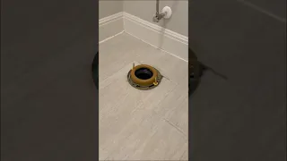 Installing a toilet.