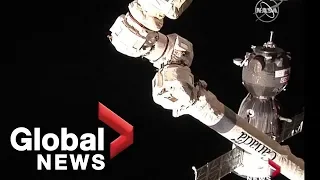 Soyuz rocket carrying American, Russian astronauts docks at ISS