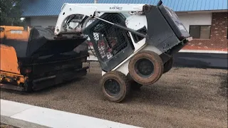 Skid-steer loading the paving machine - Black Sheep Skid