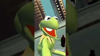 Kermit drinking juice riding a skateboard.