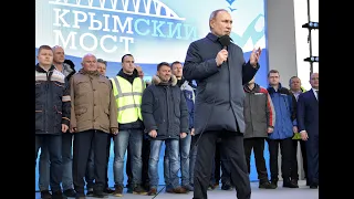 Putin takes first train across Crimea bridge