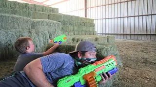 Using nerf guns on the farm | Stopping the bad guy from taking our hay | Nerf gun for kids