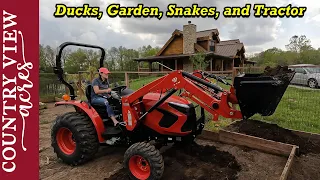 Rebekah takes over the tractor work.   Making Changes to our fenced in Garden.