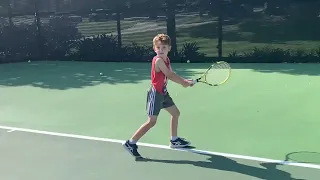 7 year old tennis player Zac Davidoff practicing