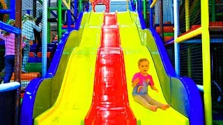 Vasena and Daddy at the Best kids play center with big slide