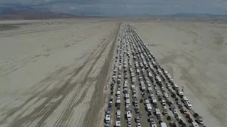 Thousands line up to leave Burning Man after torrential rain