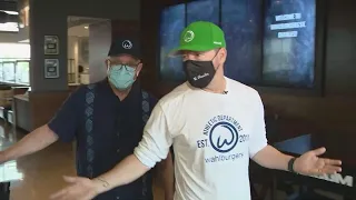 Donnie Wahlberg talks to WGN's Dean Richards at opening of St. Charles Wahlburgers