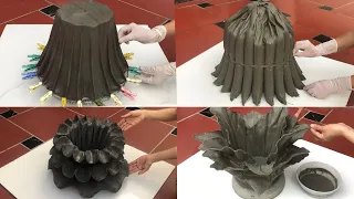 Excellent craft skills from fabric and cement to create unique beautiful plant pots for the garden.
