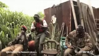 A monkey shoot AK-47 machine gun in a group of soldiers who laughed at it