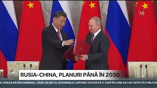 Președintele rus Vladimir Putin și omologul său chinez Xi Jinping s-au așezat la masa de negocieri