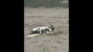 Man trapped in car rescued amid Beijing flooding caused by typhoon #doksuri