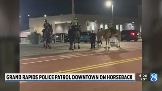 Officers on horseback manage crowds downtown, prompt leads