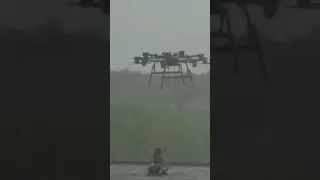 Drone dropping Robotic attack dog with machine gun