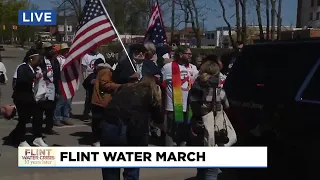 Residents march to commemorate 10 years of Flint water crisis