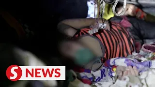 Listen to rescuers singing to a young girl trapped under rubble in Idlib