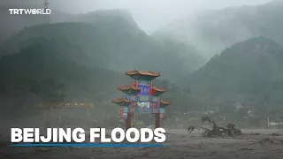 Dozens are missing after torrential rains cause massive flooding in Beijing