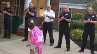 Daughters of fallen Cleveland police officer get escort to school