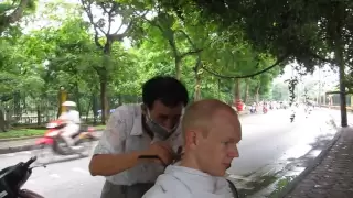 Haircut on the streets of Hanoi