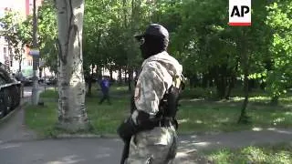 Pro-Russian separatists patrol Donetsk streets with armoured personnel carriers