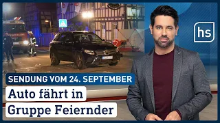 Auto fährt in Gruppe Feiernder | hessenschau vom 24.09.2022