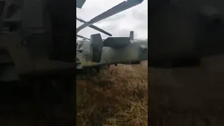 an military KA-52 attack helicopter abandoned in a field after being badly damaged by anti air
