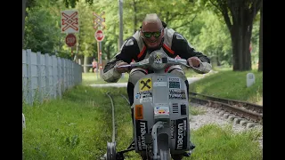 Vespa rides on the railroad tracks to the world record.