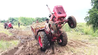 mahindra tractor stuck in mud with heavy loaded trolley rescued by mahindra tractor | tractor videos