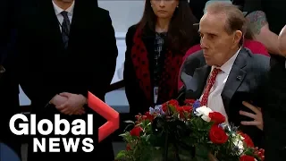 Bob Dole salutes the casket of George H.W. Bush in emotional moment