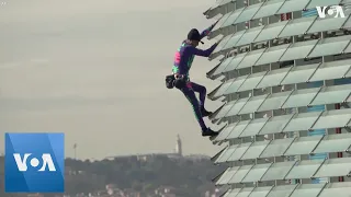 Urban Climber Scales Barcelona Building To Spotlight Coronavirus Paranoia