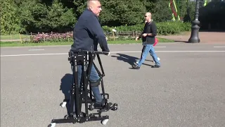 Standing frame  (with gait function) - the paraplegic walks outside. Paraplegia rehabilitation