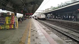 An offlink TKD WAP-7 37356 leading the 12933 Karnavati Express arrives at Vapi.