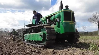 Vintage tractors ploughing