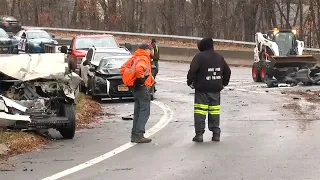 Icy roads lead to hundreds of crashes, 2 dead after exiting vehicles