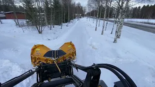 Snowplowing (cleaning roadsurface) in Hietasmäki, Ylöjärvi, Finland.