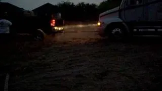 08 GMC Duramax pulling out stuck 18-wheeler truck with  trailer