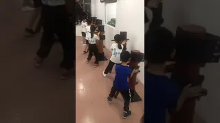 Teaching young children Wooden Dummy techniques in China . Grandmaster Samuel Kwok