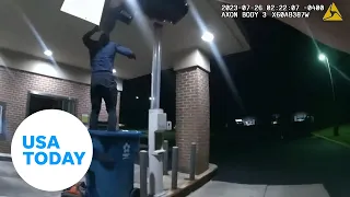 Police watch as burglar falls from bank drive-thru ceiling | USA TODAY