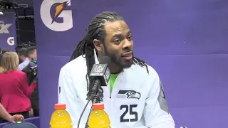 Richard Sherman gets into a debate with a reporter