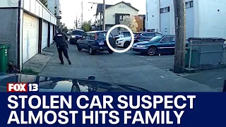 Video shows Seattle stolen SUV suspect narrowly miss crashing into family