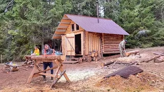 Designing a Secret Underground Food Storage in a Log Cabin. Cooking food outdoors in a cauldron