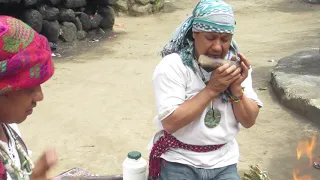 Maya shaman playing flute