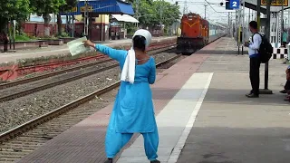 A lady gives cautionlist to the Loco pilot and Guard of a running train || Indian Railways