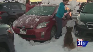 Drivers digging out cars after snowstorm brings excellent ski conditions